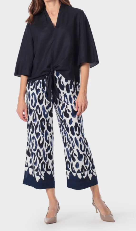 A coordinated woven look highlighting drape, print placement, and retail-ready styling.
