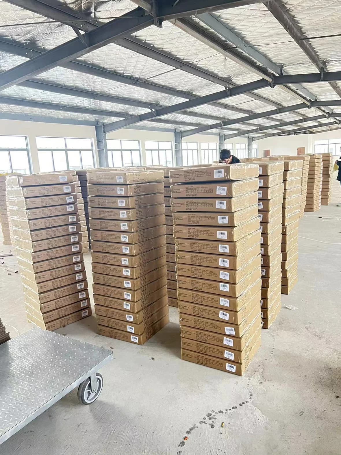 Packed cartons staged for shipment in a warehouse space.
