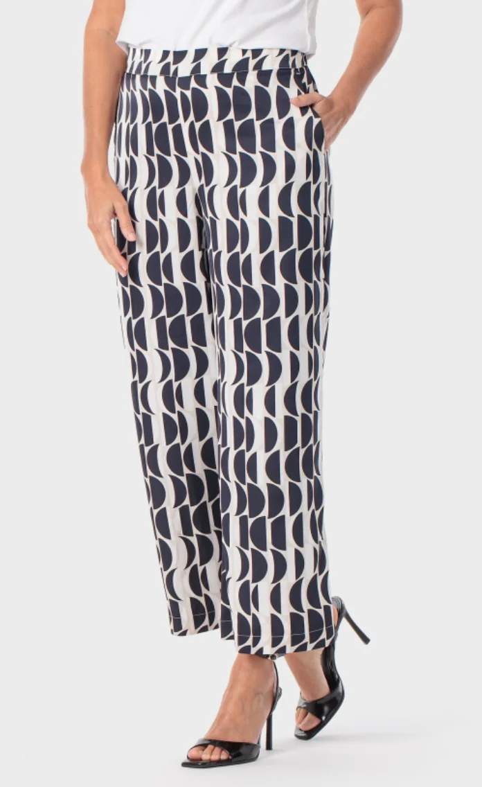 Printed woven trousers shown in a retail-ready styling shot.